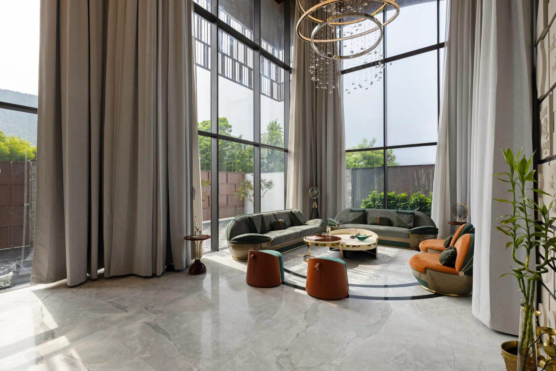 Double-height living room with floor-to-ceiling aluminium windows